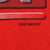 Close-up of 1996 NFLP copyright mark printed on red sweatshirt fabric