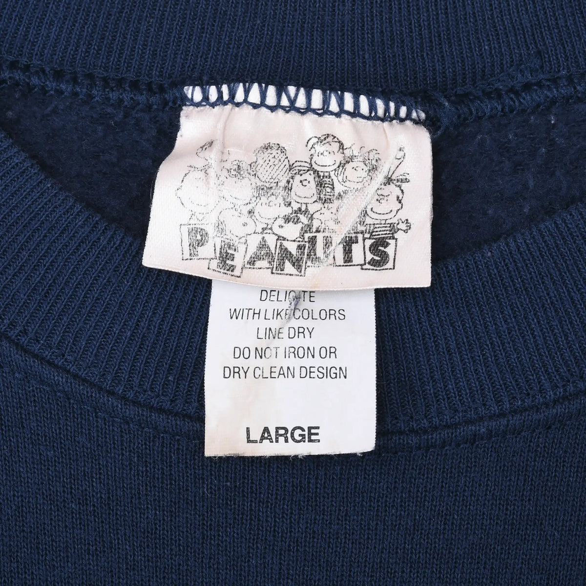 Peanuts neck label and care tag marked Large inside navy sweatshirt
