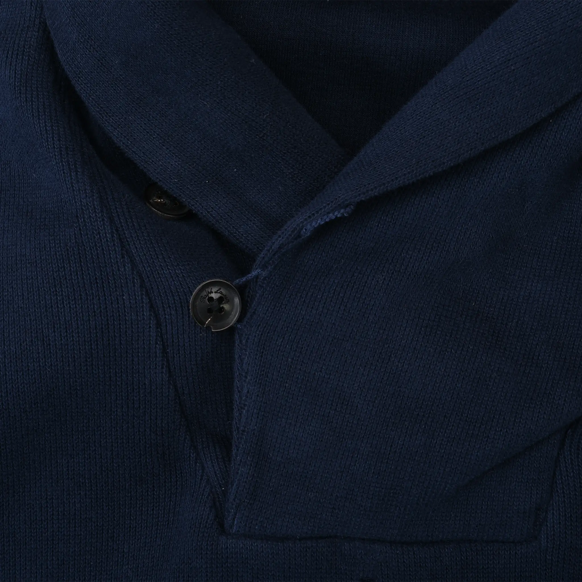 Close-up of navy shawl collar and two-button neckline