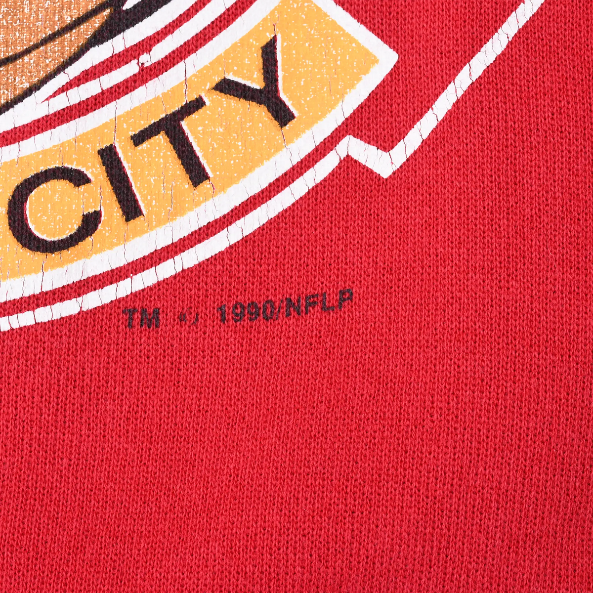 Close-up of Kansas City graphic copyright text reading TM © 1990 NFLP