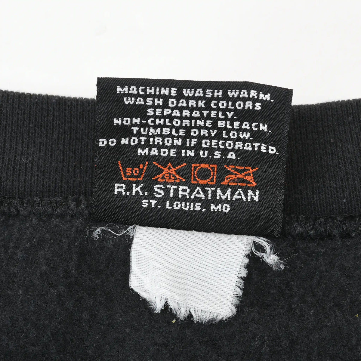 Care label with washing instructions, Made in USA, and R.K. Stratman branding
