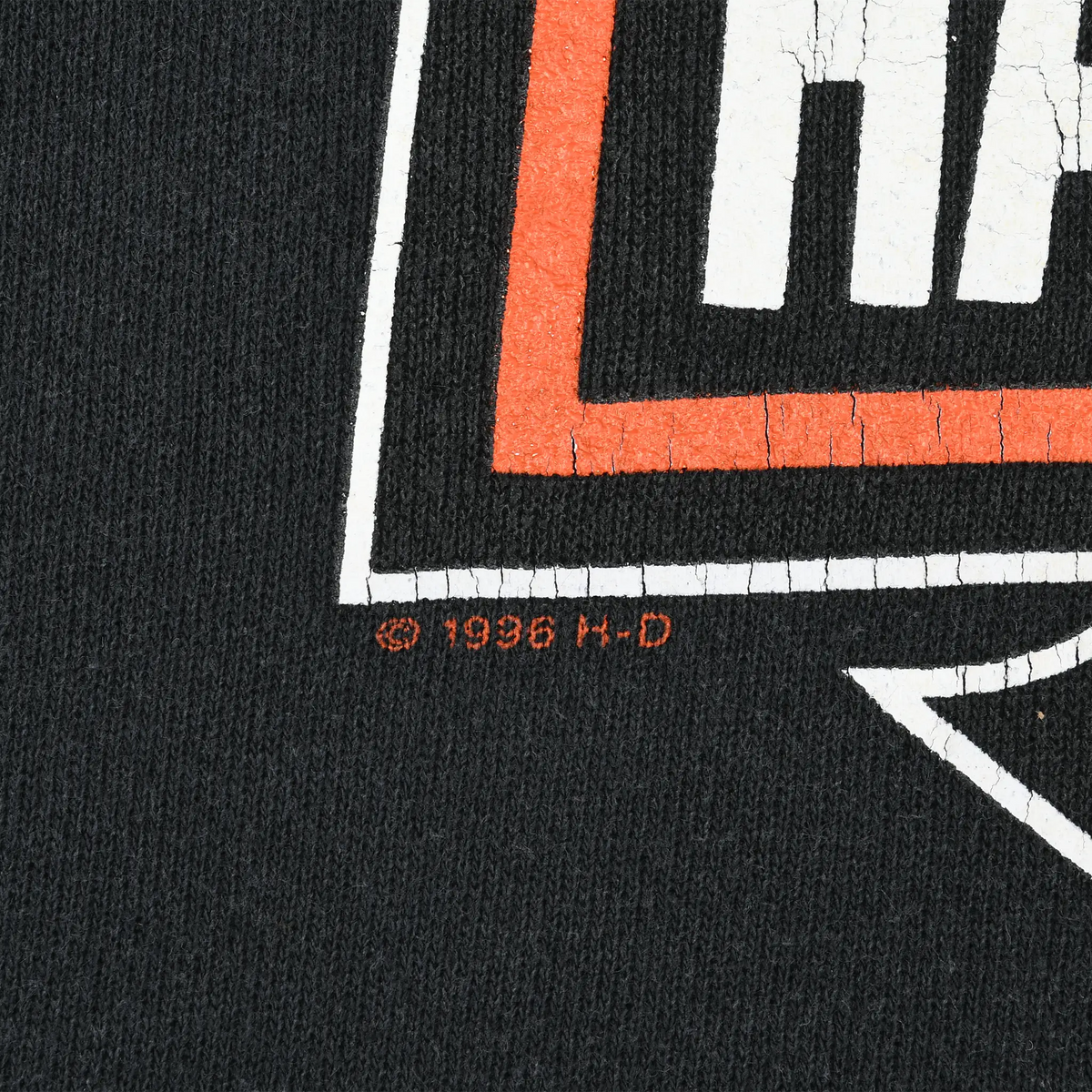 Close-up of Harley-Davidson print copyright mark reading © 1996 H-D
