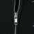 Close-up of silver YKK zipper on black Harley-Davidson hoodie