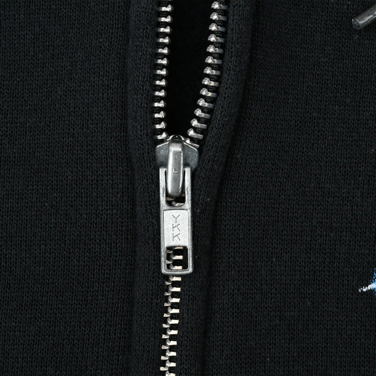 Close-up of silver YKK zipper on black Harley-Davidson hoodie