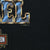 Close-up of Real Steel print edge, copyright mark, and Harley-Davidson logo on black fabric