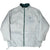 Front of light grey side of Nike reversible windbreaker with green zipper and chest Swoosh