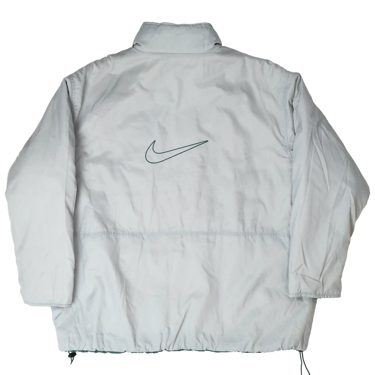 Back of light grey Nike reversible windbreaker with large green outlined Swoosh
