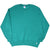 Full front view of teal Russell Athletic crewneck sweatshirt laid flat