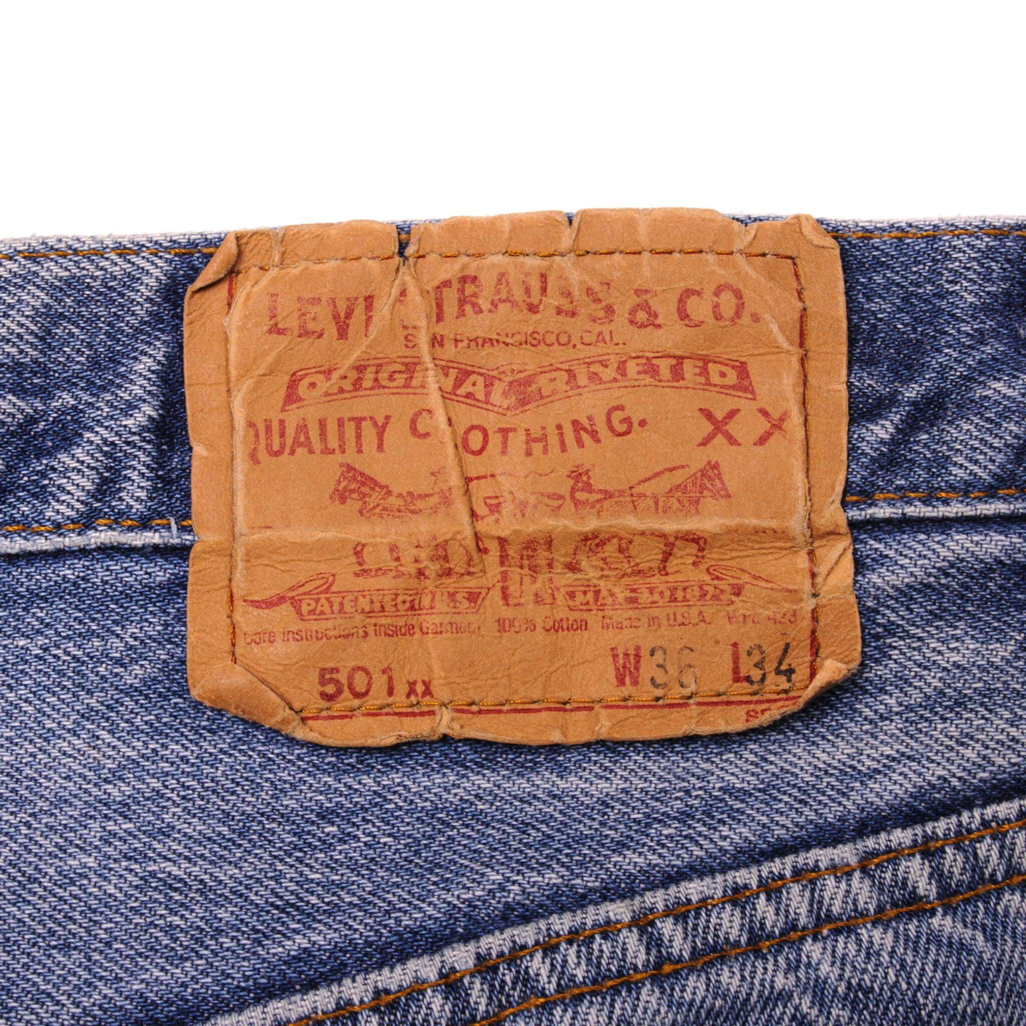 Beautiful Indigo Levis 501 Jeans Made in USA with a medium blue wash and a nice contrast of light and medium blue.  Size on Tag 36X34  ACTUAL SIZE 32X30  Back Button #524