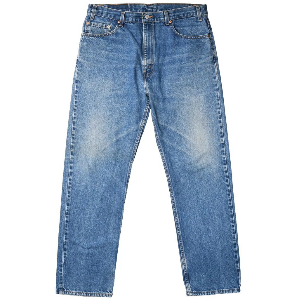 Front view of Levi's 505 indigo blue jeans with faded thighs, five-pocket styling, and zip fly