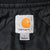 Close-up of Carhartt neck label and large size tag on black quilted lining
