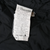 Close-up of care label inside Carhartt V01BLK vest with RN 14806 and fabric details