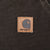 Close-up of square Carhartt logo patch on dark brown front pocket
