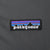 Close-up of embroidered Patagonia mountain logo patch on gray chest fabric