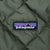 Patagonia logo patch on green diamond-quilted liner fabric