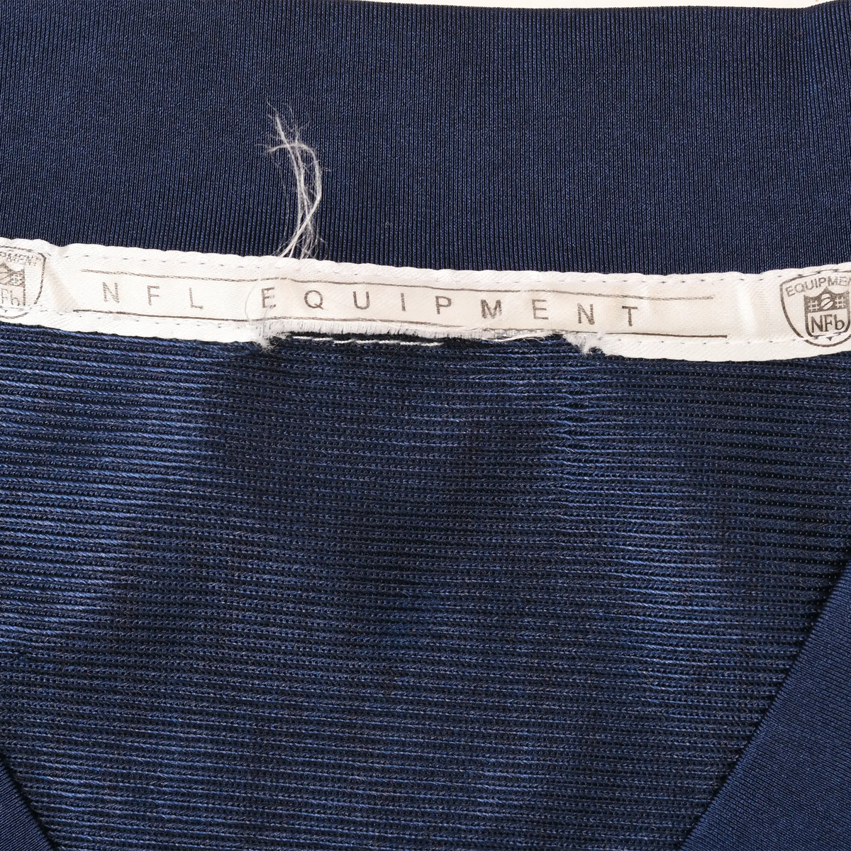 Close-up of NFL Equipment neck tape inside navy jersey collar