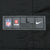 Close-up of NFL Players Nike size L jock tag stitched near the jersey hem