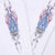 Close-up of red, blue and gray flame graphics with Harley-Davidson logos on both sleeves