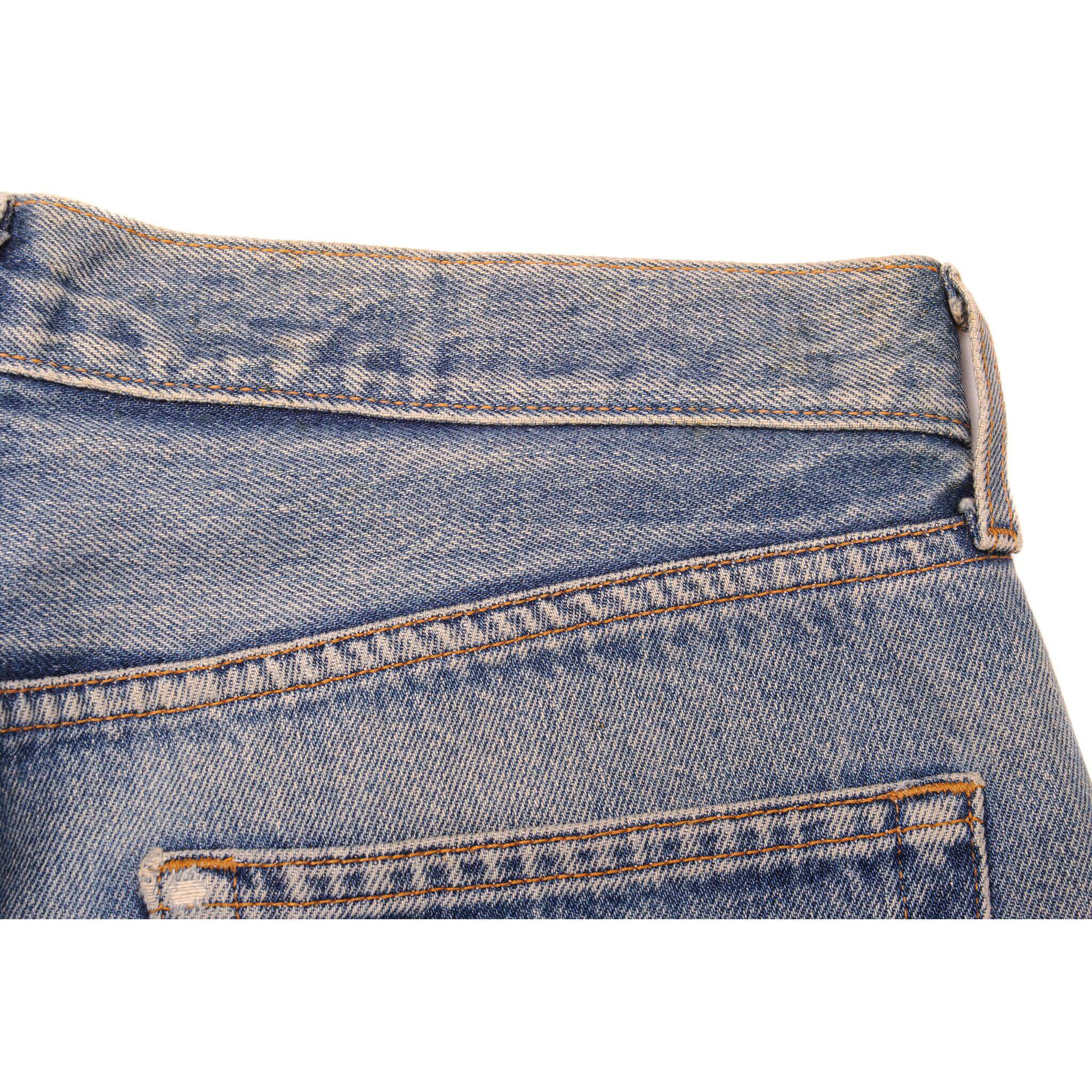 Beautiful Indigo Levis 501 Jeans 1990s Made in USA with a medium blue wash, a nice contrast of light and medium blue and some strong whiskers.  Size on Tag 34X36  ACTUAL SIZE 33X34  Back Button #977