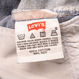 Beautiful Indigo Levis 501 Jeans 1990s Made in USA with a medium blue wash, a nice contrast of light and medium blue and some strong whiskers.  Size on Tag 34X36  ACTUAL SIZE 33X34  Back Button #977