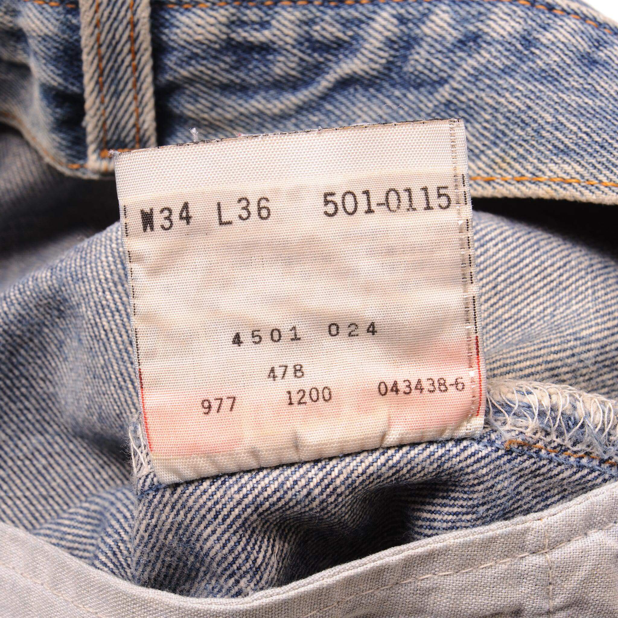 Beautiful Indigo Levis 501 Jeans 1990s Made in USA with a medium blue wash, a nice contrast of light and medium blue and some strong whiskers.  Size on Tag 34X36  ACTUAL SIZE 33X34  Back Button #977