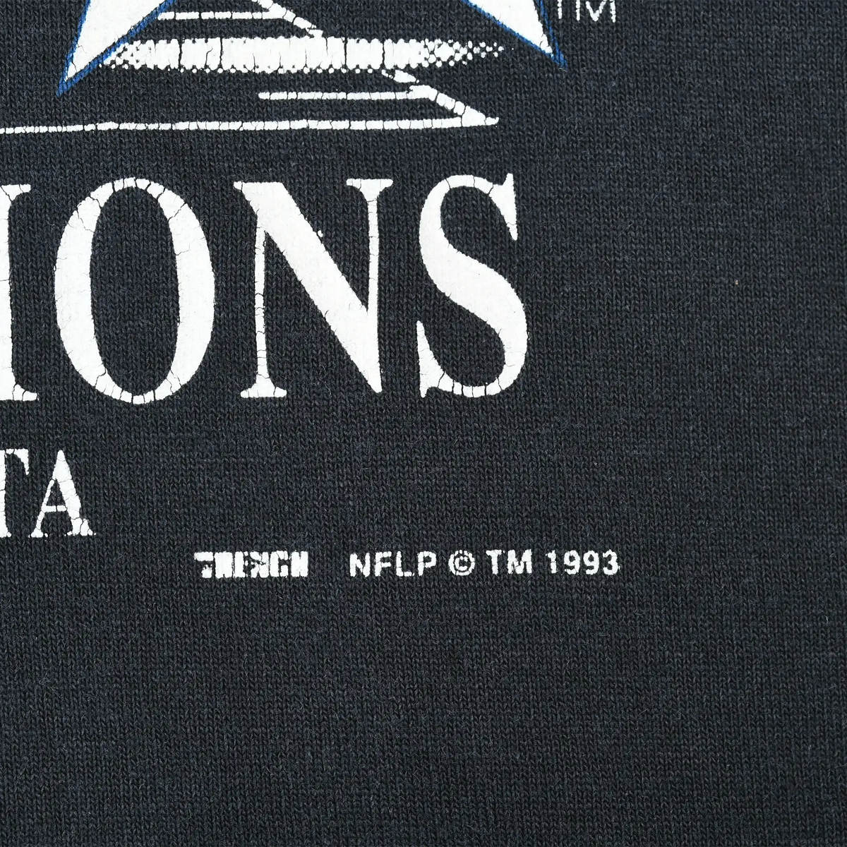 Close-up of T-shirt graphic showing Trench and NFLP copyright and trademark text dated 1993