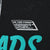 Close-up of The Three Stooges copyright print beside turquoise graphic lettering