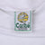 Close-up of Caribe Sportswear Los Angeles neck label inside white sweatshirt
