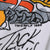 Close-up of printed artist signature and TM NFLP 1988 copyright detail