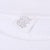 Close-up of sweatshirt care label marked XL, made in USA, beneath white ribbed collar