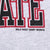 Close-up of Wild West Shirt Works maker mark beneath the printed sweatshirt graphic
