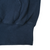 Close-up of navy hoodie waistband, pocket seam, and sleeve cuff
