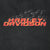 Close-up of red Harley-Davidson chest logo with orange accents and gray flames