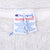 Close-up of Champion Reverse Weave neck label inside gray sweatshirt