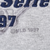 Close-up of MLB 1997 copyright mark beneath the embroidered sweatshirt graphic