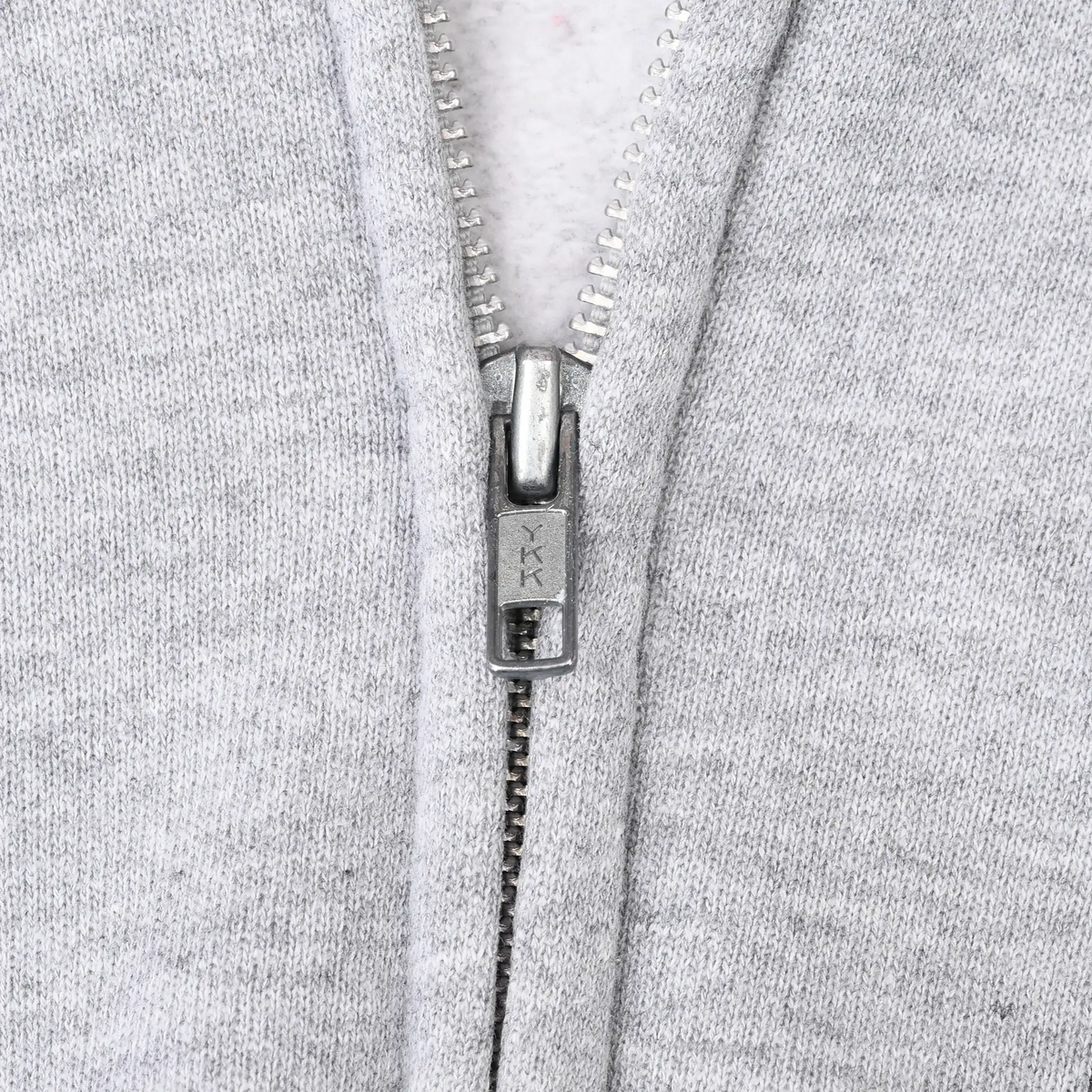 Close-up of metal YKK zipper on gray Harley-Davidson hoodie