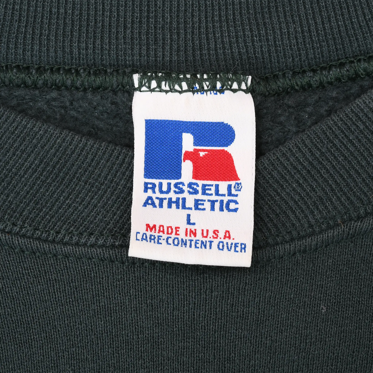 Russell Athletic size L neck tag with Made in USA and care content over text