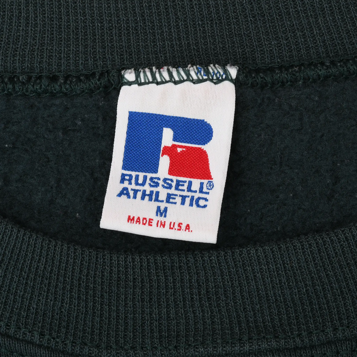 Russell Athletic size M neck label with Made in U.S.A. text