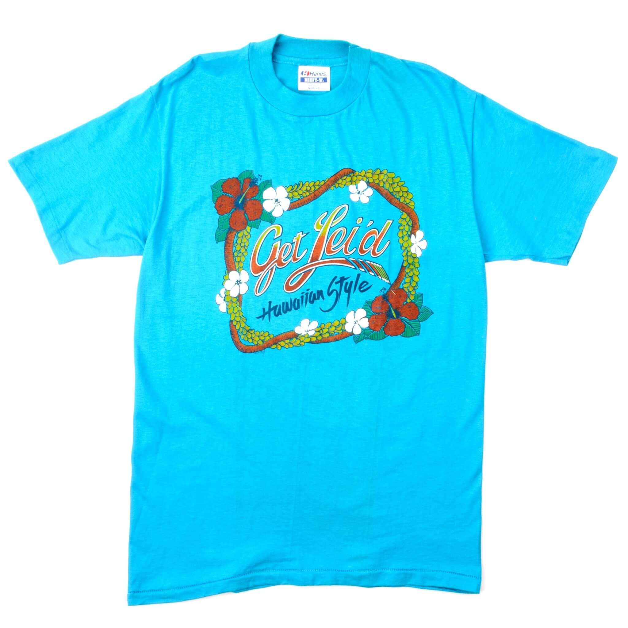 Vintage Hawaii Get Lei'd Hawaiian Style Tee Shirt Size Medium Made In USA. LIGHT BLUE