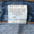 Close-up of reverse care label with washing instructions and Levi's 505 product codes