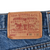 Close-up of tan Levi Strauss & Co. two-horse waistband patch marked 505, W38 L32