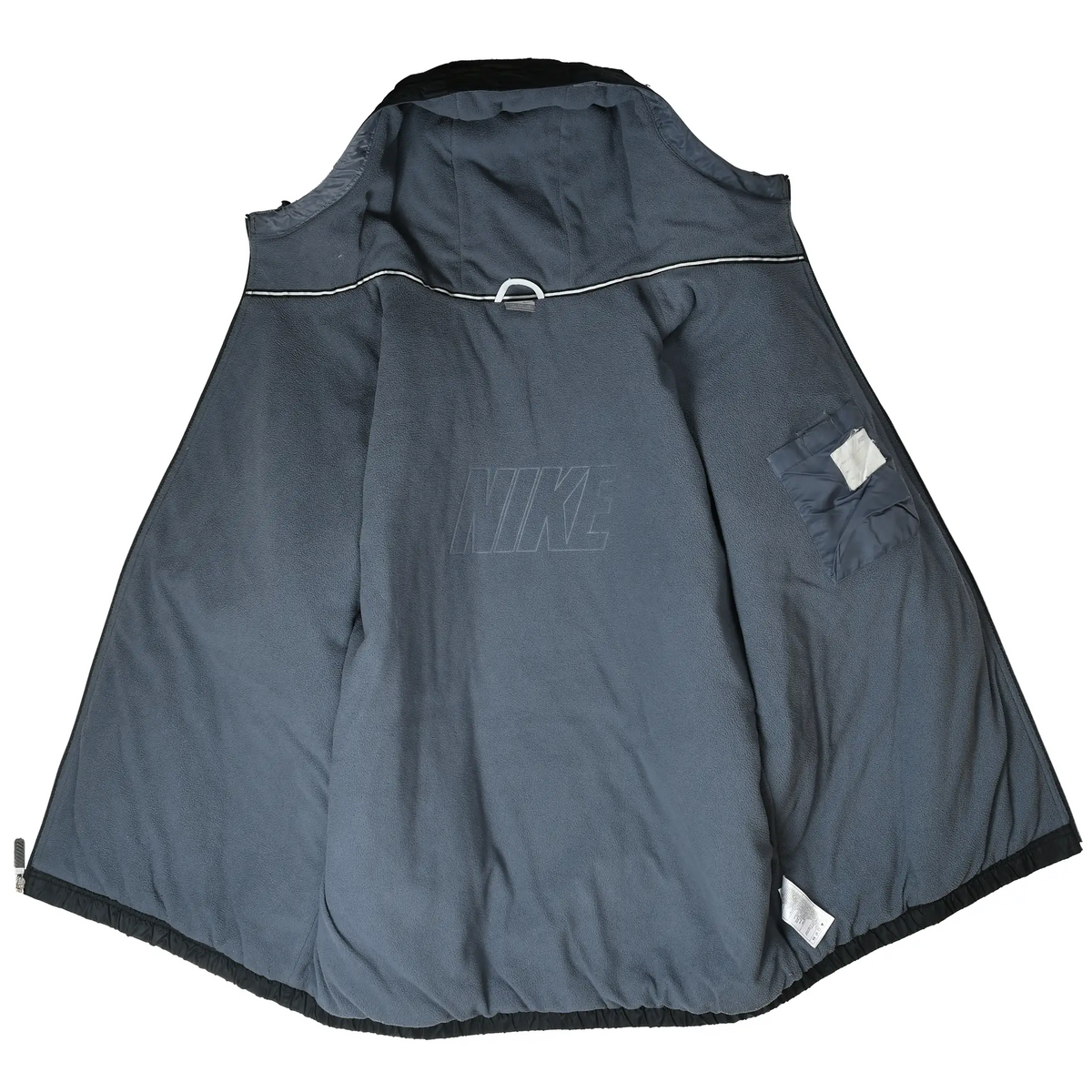 Open black Nike jacket showing gray fleece lining and interior pocket