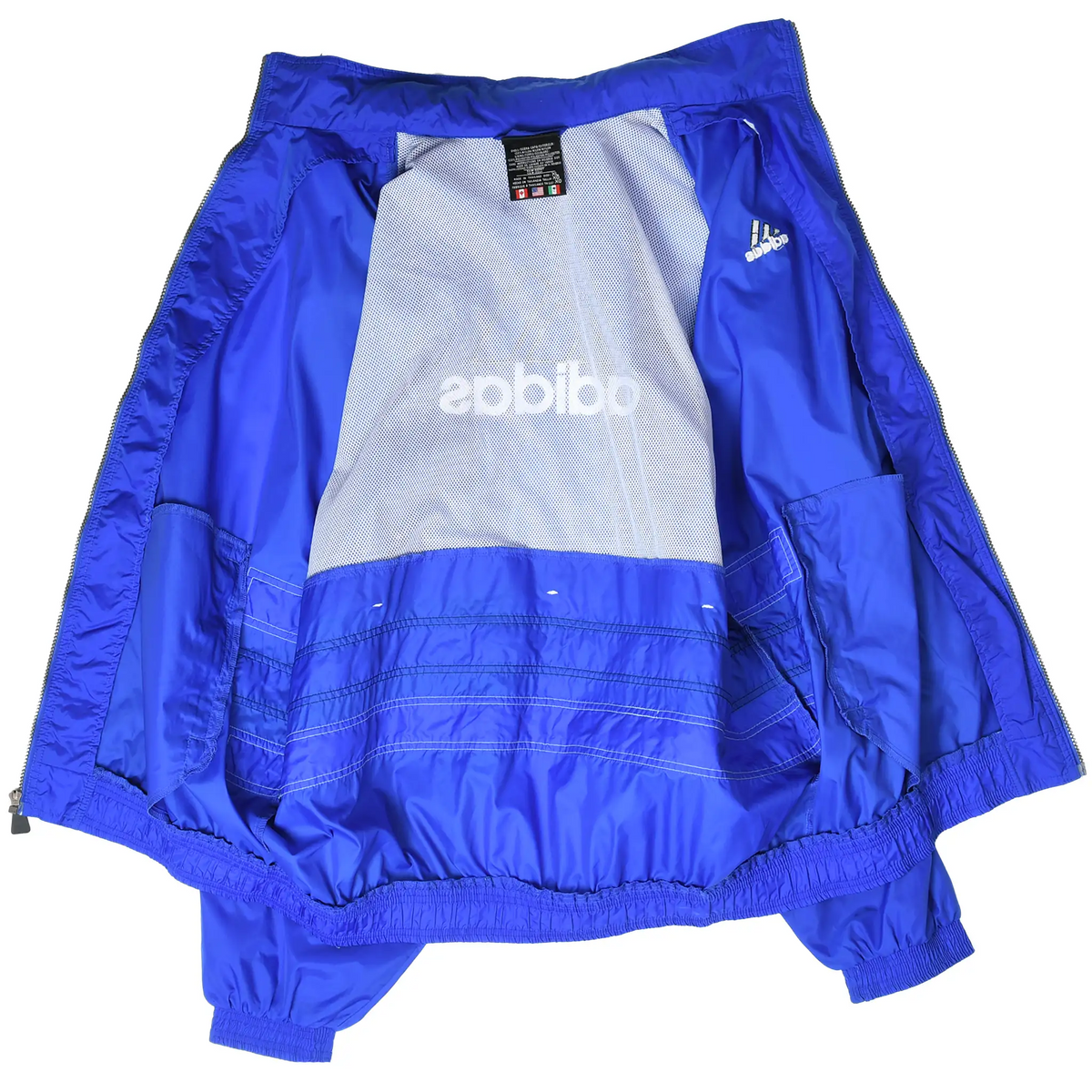 Open royal blue adidas windbreaker showing white mesh lining, inner label, and interior logo