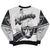 Back of silver and black Raiders sweatshirt with ship, wordmark, shield, and striped graphics