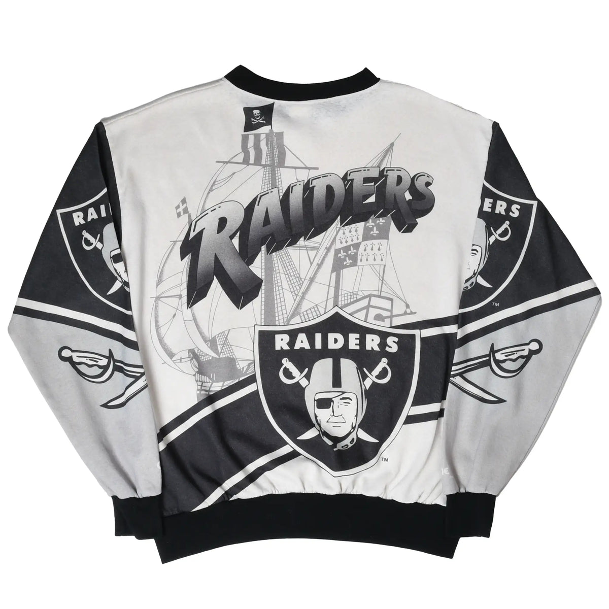 Back of silver and black Raiders sweatshirt with ship, wordmark, shield, and striped graphics