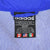 Close-up of adidas XL neck label against white mesh lining inside the blue windbreaker