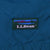 Close-up of embroidered L.L.Bean landscape logo patch on teal fabric