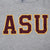 Close-up of maroon ASU appliqué lettering with gold trim on gray fabric