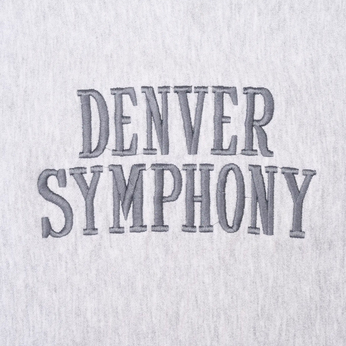 Close-up of gray Denver Symphony lettering on sweatshirt chest