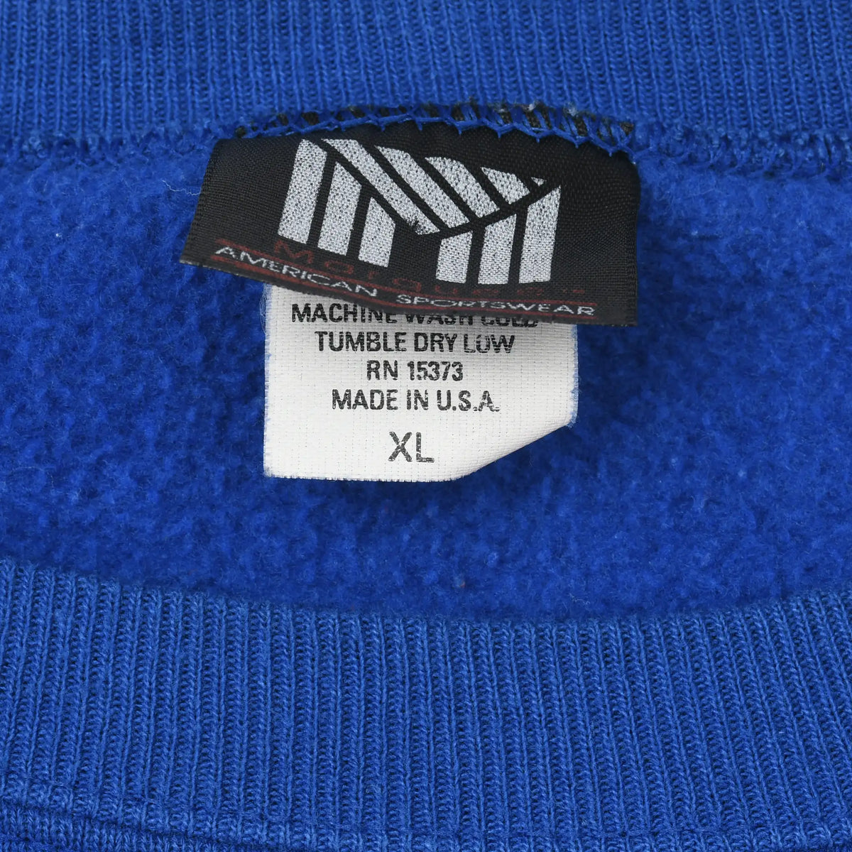 Morning Sun sweatshirt labels showing care instructions, made in USA, and size XL